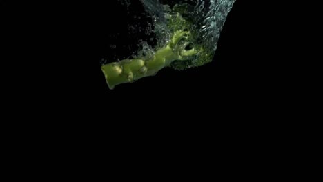 animation of red shapes over broccoli on black background