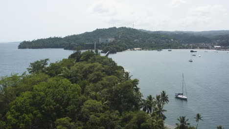 aerial - bridge between islands of samana, dominican republic, backwards wide shot