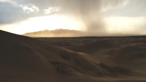 distant storm approaching the dunes