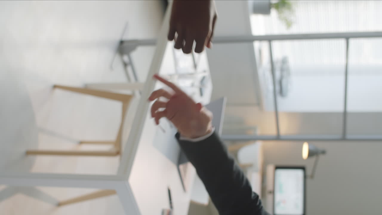 Handshake of Multiethnic Business Partners in Office