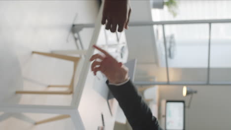 handshake of multiethnic business partners in office