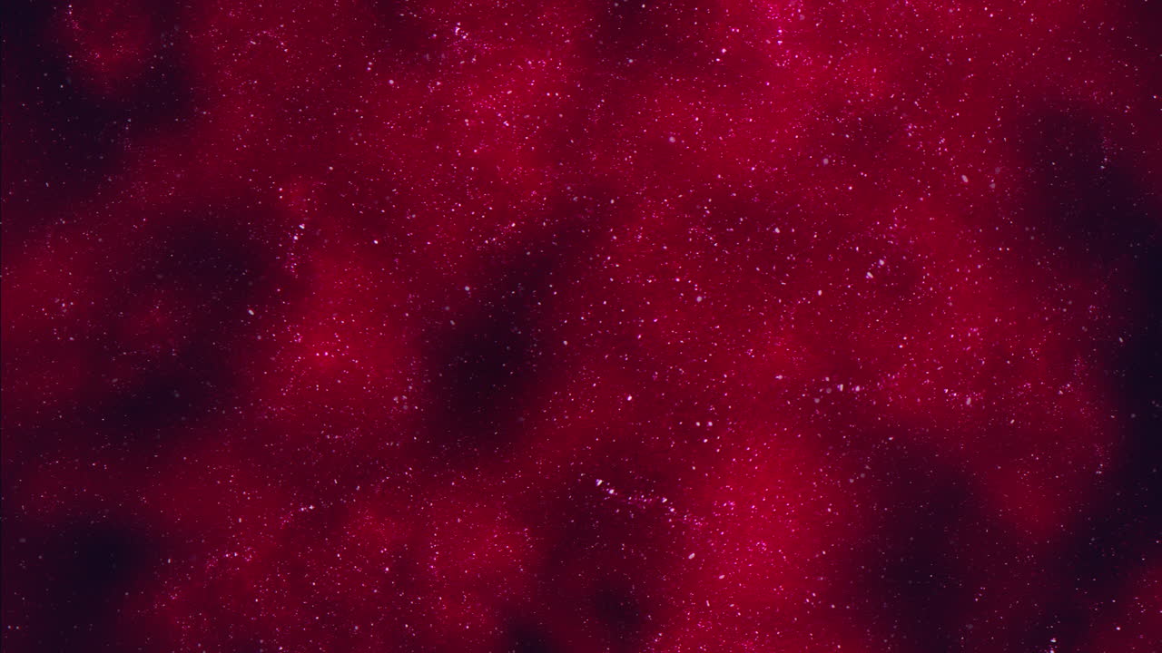 Abstract red glitter particles background with soft bokeh and shimmering texture