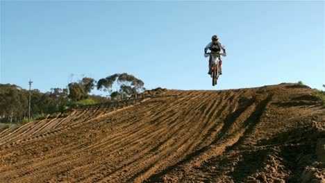 man riding a motor cross bike