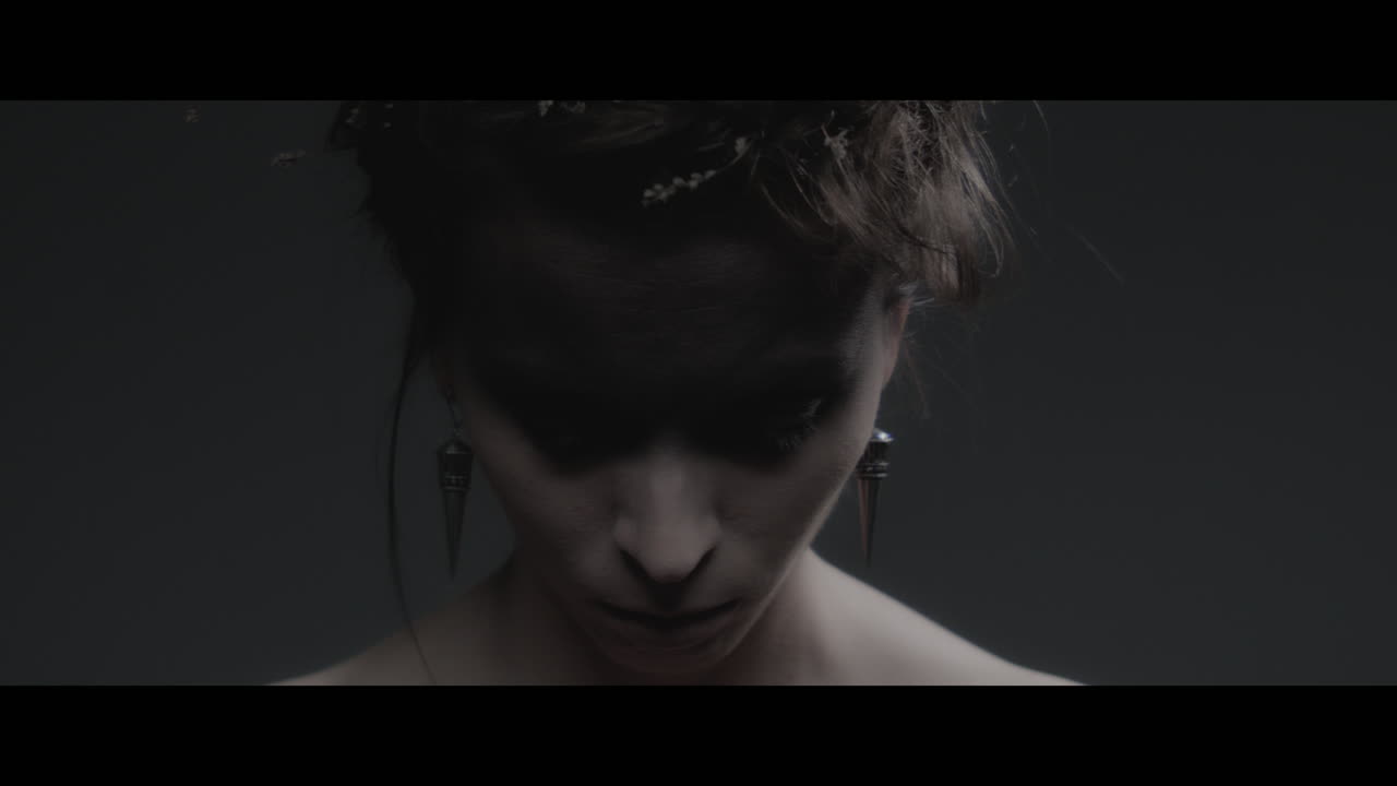 A woman dressed as mother nature rise her head