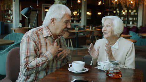 elderly couple enjoying a relaxing cafe meeting