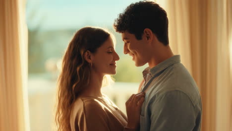 romantic couple sharing an intimate moment by the window