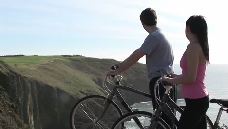 two people looking at cliff