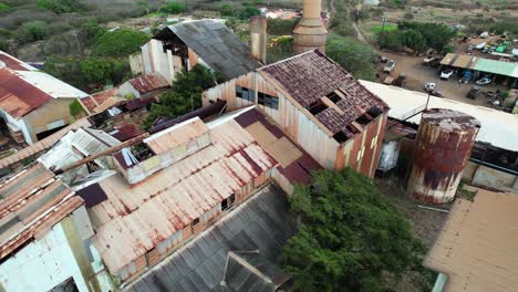 above-rusty-and-old-koloa-sugar-mill-in-kauai-hawaii,-circle-aerial-view