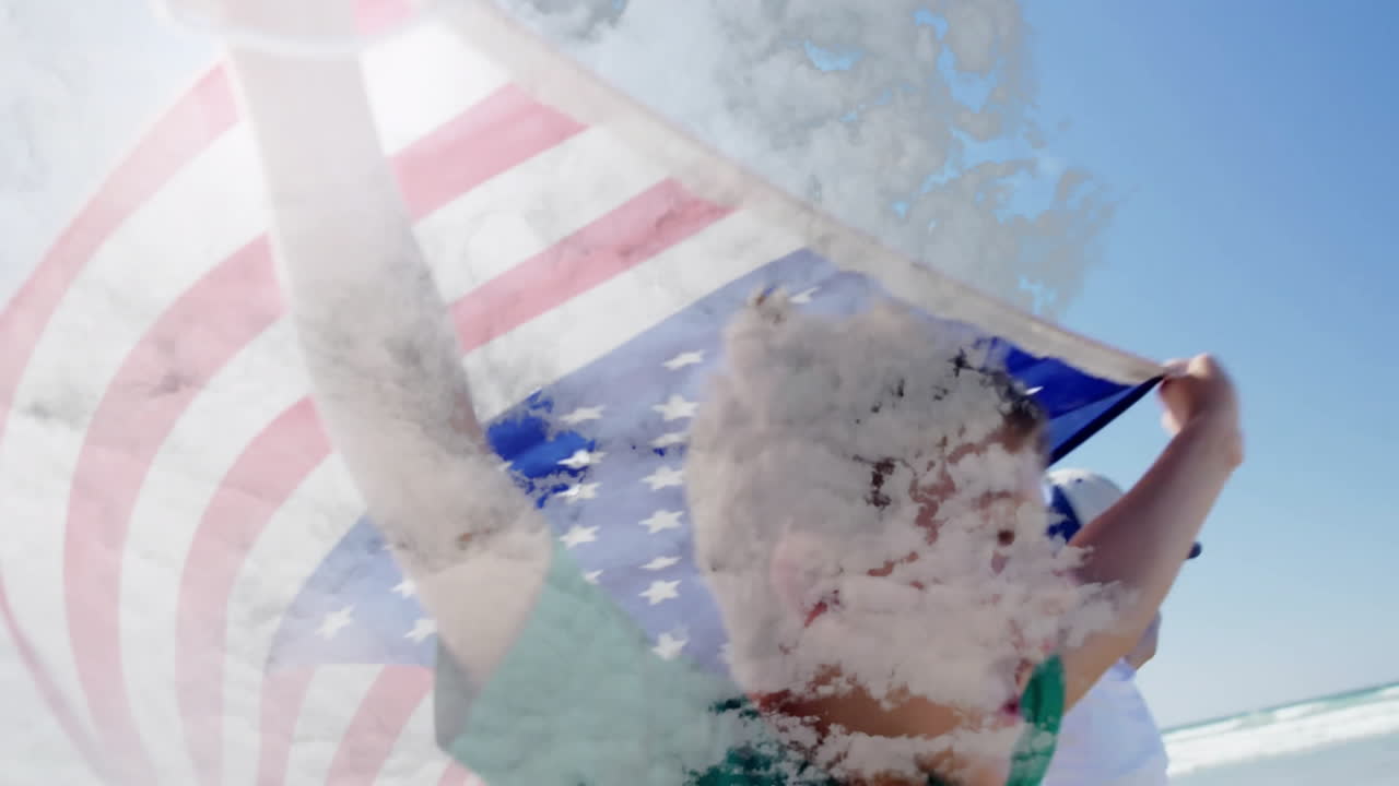 Holding American flags, people standing on beach with ocean waves animation