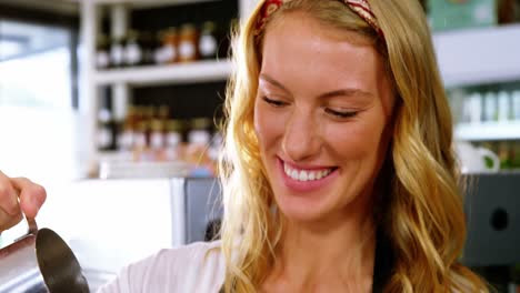 waitress making cup of coffee