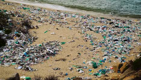 landscape of beach polluted by plastic rubbish, climate change concept