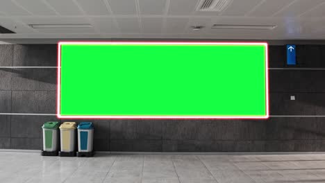 empty blank widescreen billboard with green screen, alpha channel. chroma key frame on airport hall, big banner for marketing.