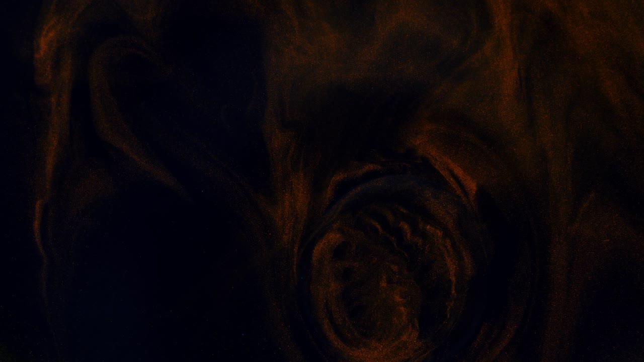 Flow of red and gold colors on a black three-dimensional moving background, transition.