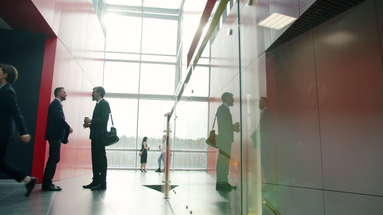 Business people in a modern office hallway