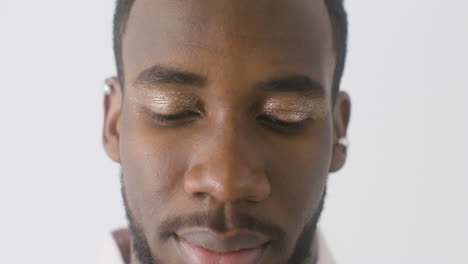 close up of man staring at front with make up