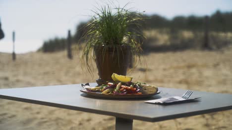 fancy food on a plate on the beach