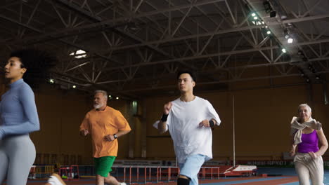 people running in an indoors track