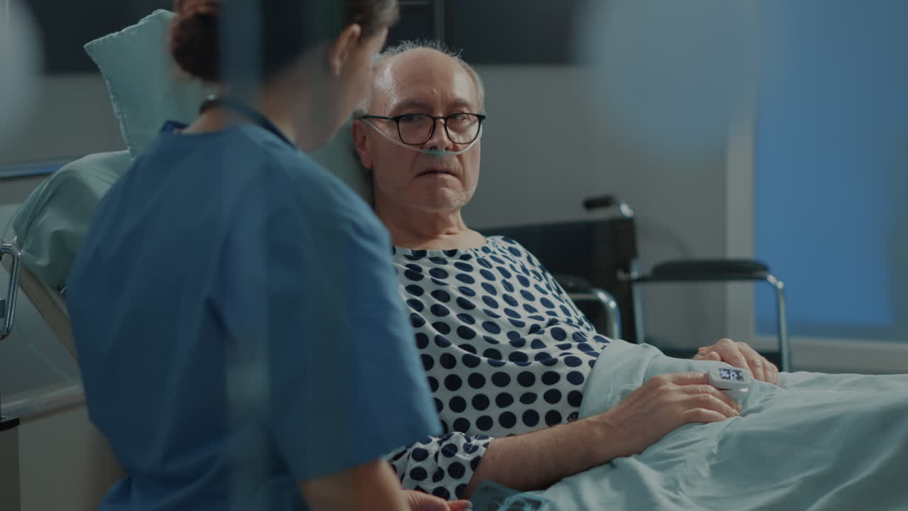 Medical nurse explaining xray results to sick patient