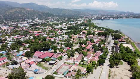 rising drone footage of dili, the capital of timor leste in south east asia