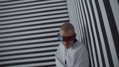 futuristic patient in a striped room