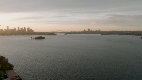 sydney skyline from point piper with sunset over the harbor, showcasing the iconic sydney harbour bridge