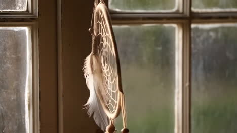 dreamcatcher in sunlight by a window
