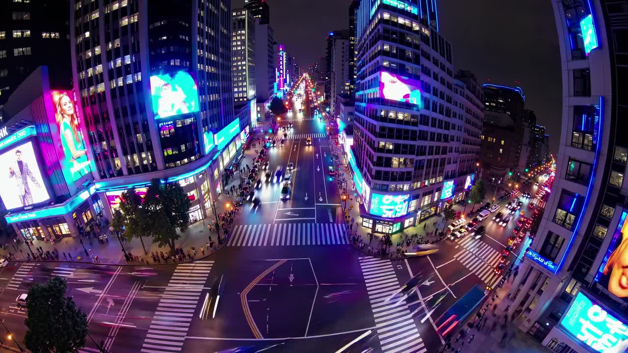 Vibrant cityscape at night from a high-angle, fisheye lens