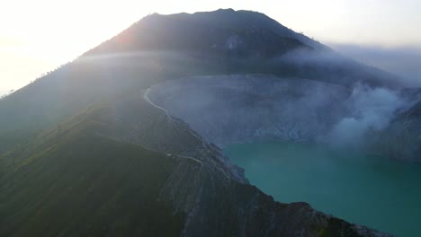 aerial view of ijen acid lake with the sun rise at the background in java indonesia