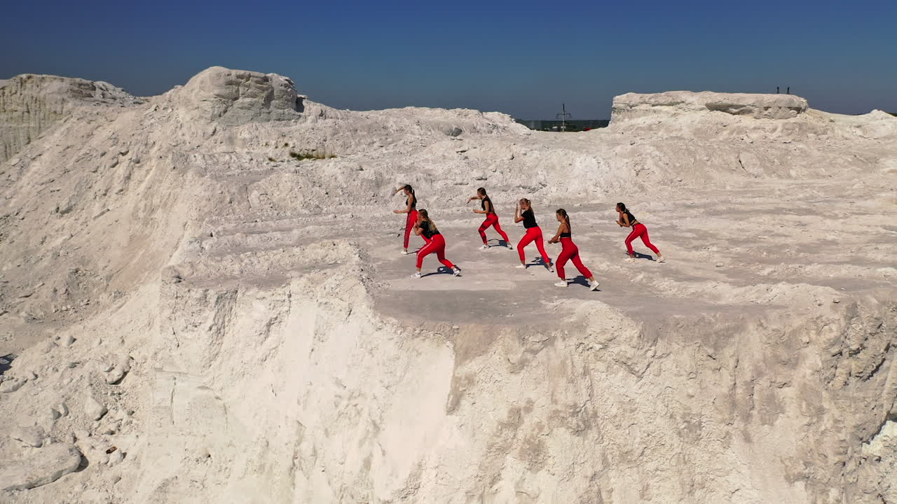 Group Dance Performance on a Hill