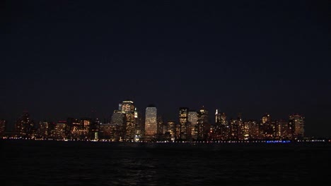 the new york city ny skyline glows at night