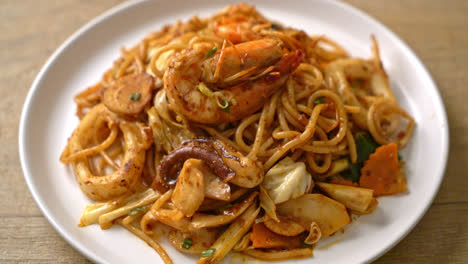 stir fried tom yum seafood dried spaghetti - fusion food style