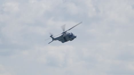 nh-90 search and rescue helicopter flying - low angle tracking shot