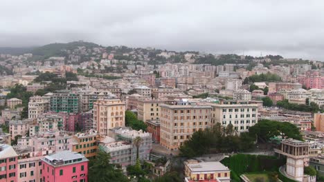 City-of-Genoa-skyline-on-moody-day,-aerial-cinematic-dolly-zoom-effect-view