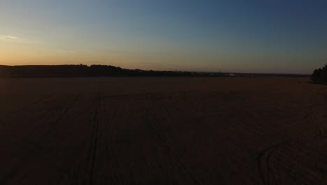 sunset over a harvested wheat field