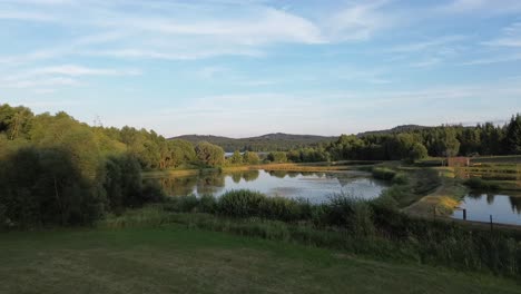 slow forward camera movement over small ponds in the countryside