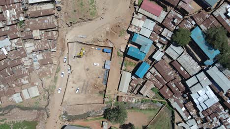 drone bird view : cars moving on the poor roads of the slums of kibera nairobi kenya
