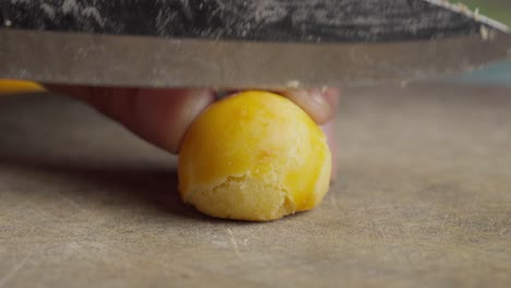 knife slices golden nastar revealing buttery layers and sweet pineapple filling