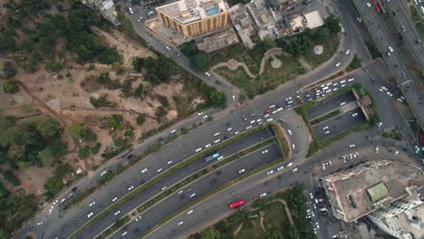 Aerial-Shot-Of-Cars-Driving-On-A-Busy-Highway,-Transportation-Infrastructure-In-Pakistan