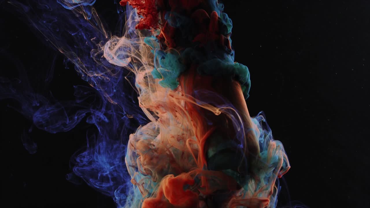 Vibrant Colorful Ink Swirling and Mixing in Dark Liquid