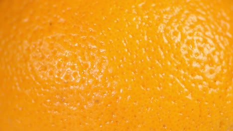 juicy orange in the peel slowly rotates.