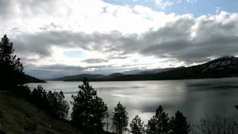 Bright-sunlight-pierces-through-storm-clouds-passing-over-an-Idaho-Lake