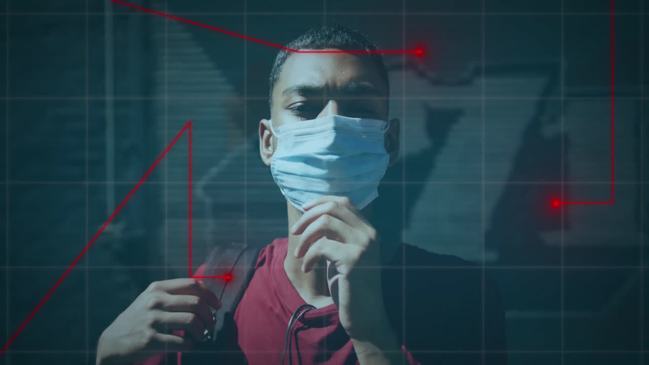 Animation of graph over biracial man wearing face mask