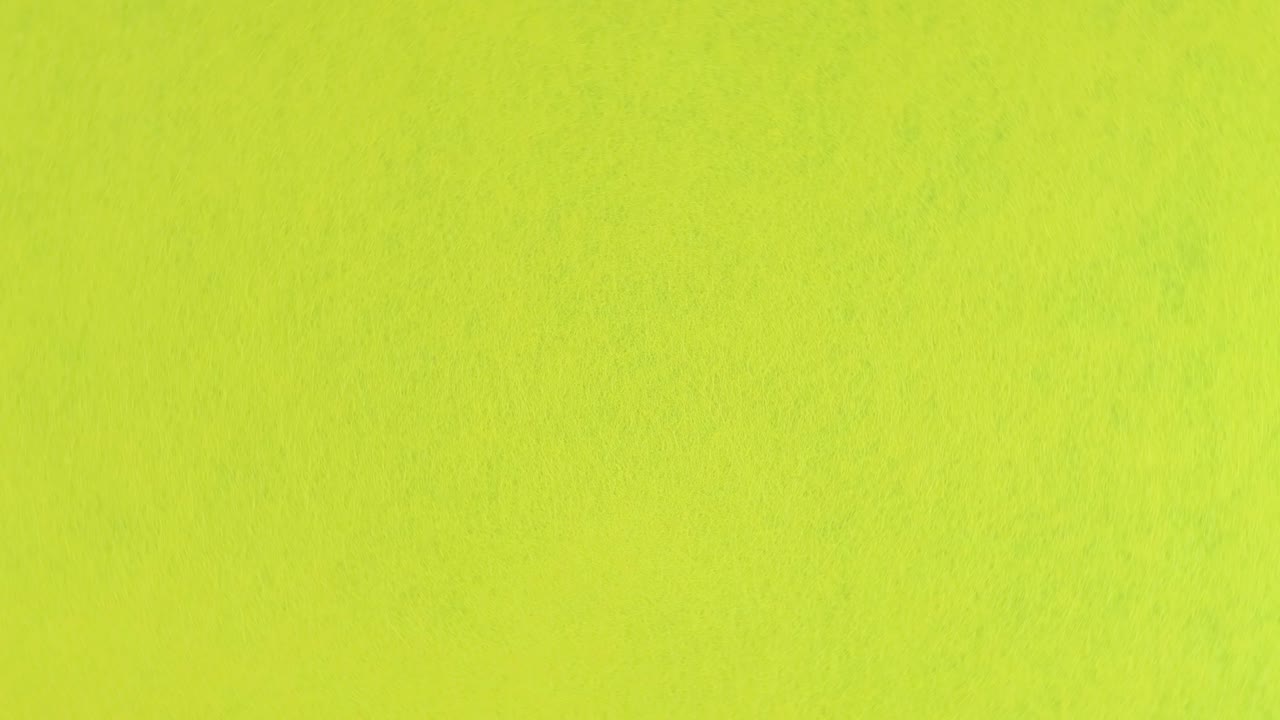 fondo de lana amarilla o tela en un plato giratorio de primer plano, vista de arriba.