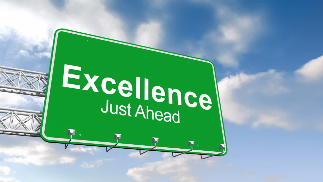 Excellence just ahead sign against blue sky 