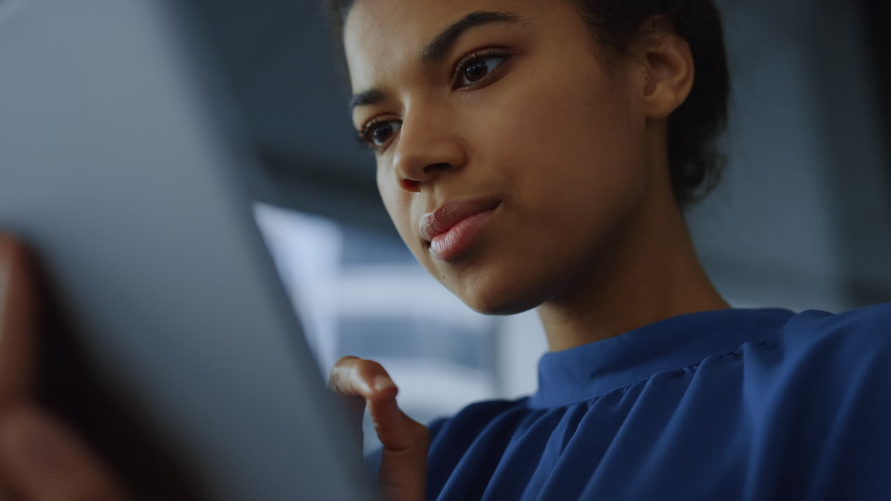Businesswoman typing email message on tablet. Manager using touchpad on tablet