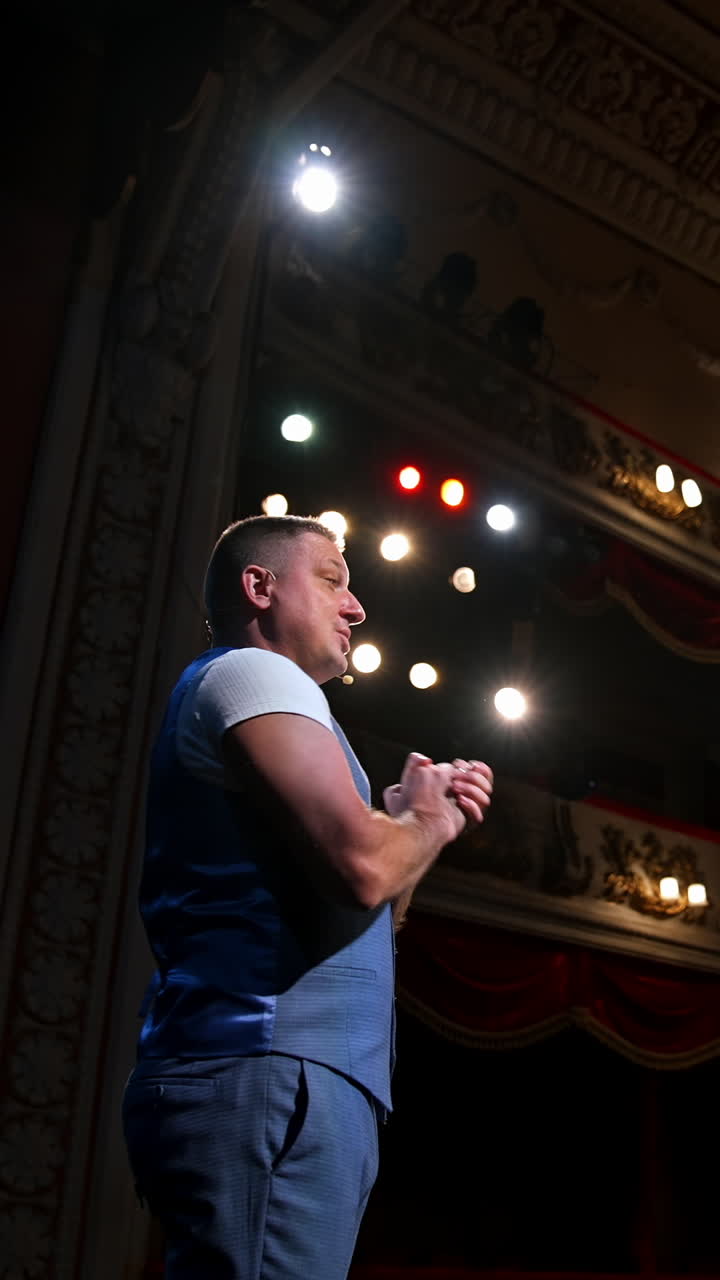 Young actor performing a monologue in a theater. Showman. Vertical video