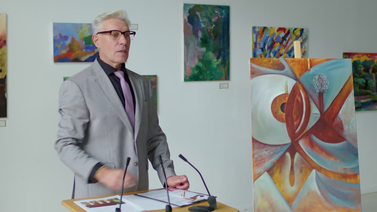 Auctioneer Selling Painting during Auction