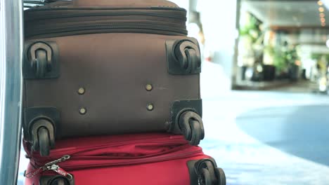 Stack-of-suitcases-on-hotel-lobby-,