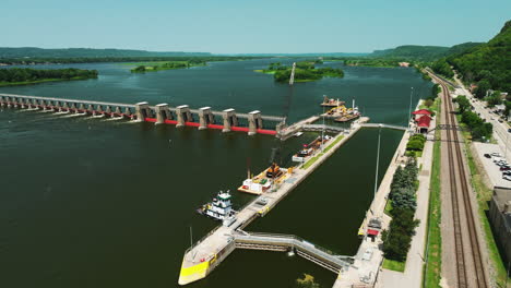 Establishing-view-of-US-lock-and-Dam-4-in-Mississippi-river,-tilting-down