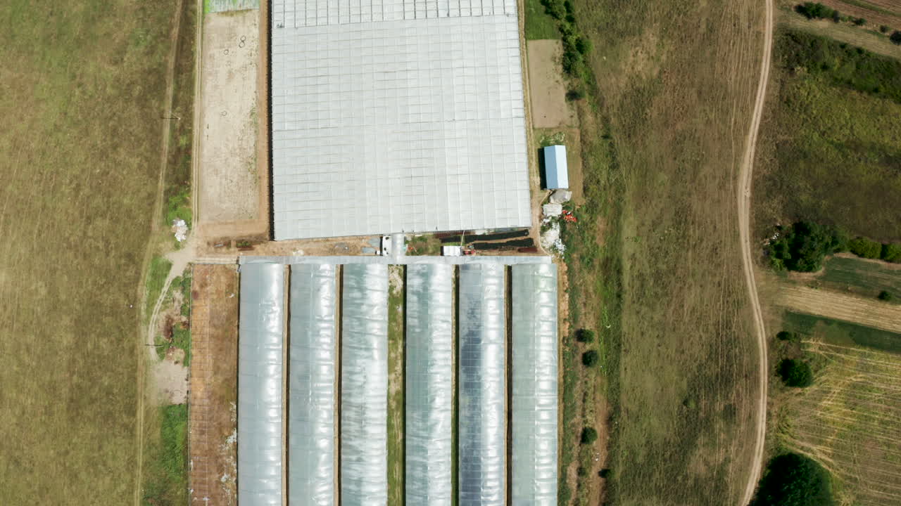 Aerial View of Greenhouses and Farmland